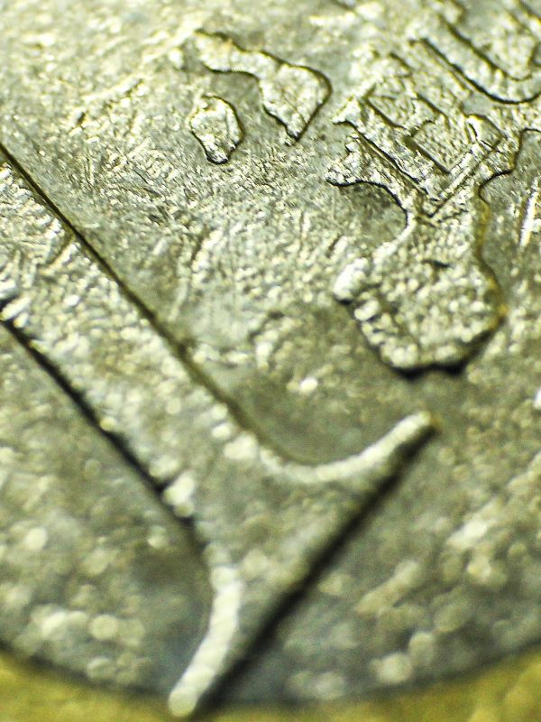 A close-up of a €1 coin
